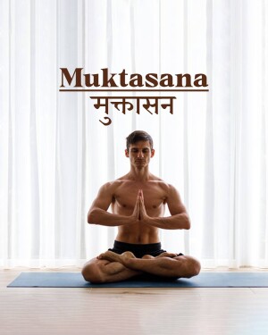 Man meditating in Muktasana pose with white curtains in the background