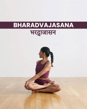 Woman performing Bharadvajasana yoga pose