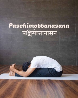 Man performing Paschimottanasana yoga pose