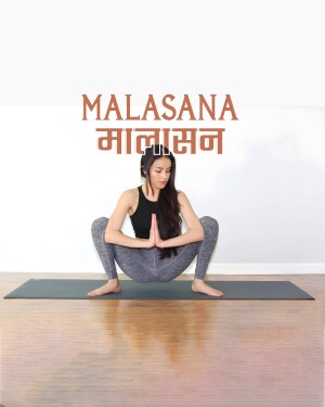 Woman performing the Malasana yoga pose on a yoga mat
