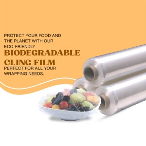 Rolls of biodegradable cling film with a bowl of fruit