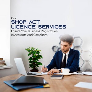 Man working on laptop with text 'Shop Act Licence Services'