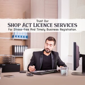 Man working on a computer with text promoting Shop Act Licence Services