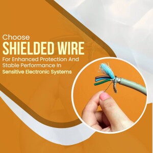Close-up of shielded wire being held, highlighting its internal components.