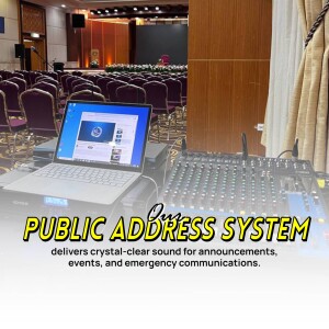 Laptop and audio mixing console with 'Public Address System' text overlay