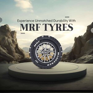 MRF Tyre on a pedestal with a mountain backdrop
