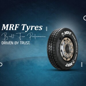 Close-up of an MRF Steel Muscle tyre against a blue gradient background.