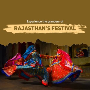 Two women in traditional Rajasthani attire performing a dance with a fort in the background.