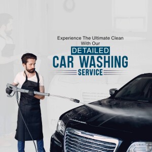 Man washing a black car with a pressure washer