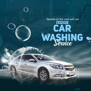 Silver car being washed with bubbles and water spray