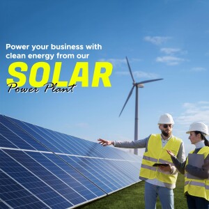 Two engineers inspecting solar panels with a wind turbine in the background, promoting clean energy.