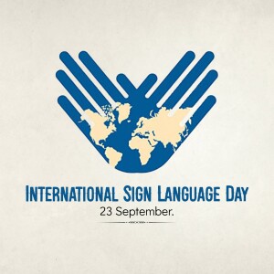 Image depicting hands forming a shape around a world map with text 'International Sign Language Day - 23 September'
