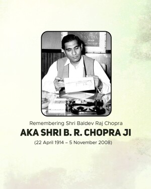 Black and white portrait of B.R. Chopra at his desk