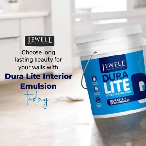 A bucket of Jewell Dura Lite Interior Emulsion paint in a home setting.