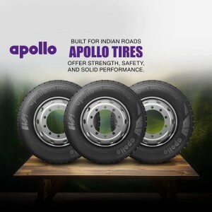 Three Apollo tires displayed on a wooden platform with the tagline 'Built for Indian Roads'