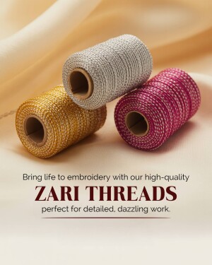 Close-up of three spools of colorful zari threads - gold, silver, and maroon.