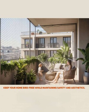 A woman and child relaxing on a balcony protected by a bird safety net.