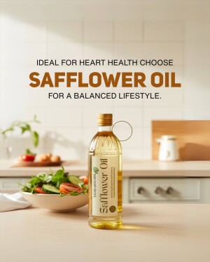 Bottle of safflower oil with fresh vegetables in a kitchen setting