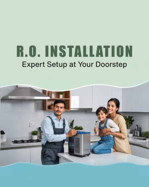 Family in a modern kitchen with an R.O. water purifier being installed by a technician.