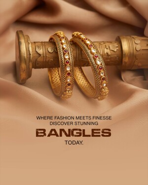 Close-up of ornate gold bangles with red stone embellishments