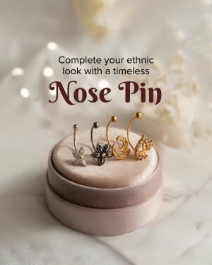 Close-up of various gold and silver nose pins displayed on a velvet cushion.