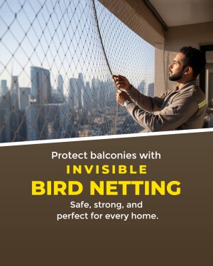 A worker installing invisible bird netting on a balcony with a city view.