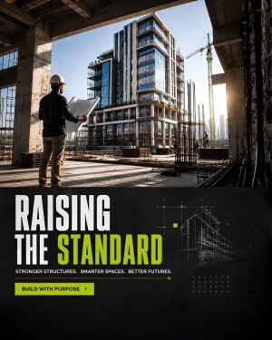 A structural engineer viewing a large modern building construction site at sunset