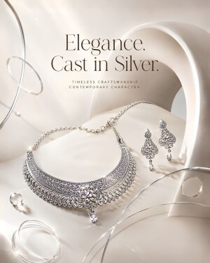 Luxury silver necklace and earrings set with intricate filigree details on an abstract cream background