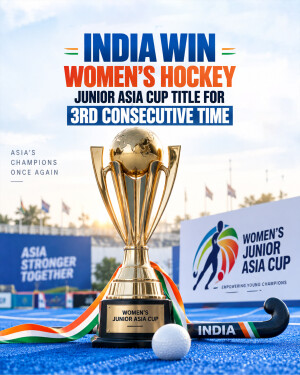 The Women's Junior Asia Cup trophy stands on a blue hockey field with a hockey stick and ball, celebrating India's third consecutive championship win.