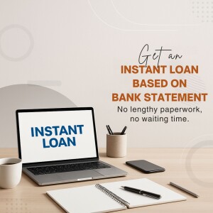 Laptop displaying instant loan offer with office supplies