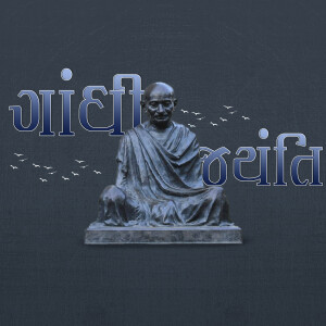 Statue of Mahatma Gandhi with birds and text in Devanagari script