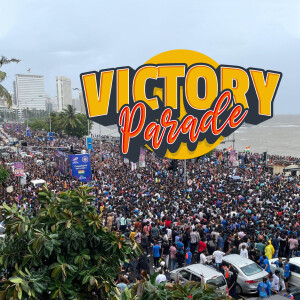 Large crowd celebrating the Mumbai Indians cricket team's victory parade along Marine Drive, Mumbai.