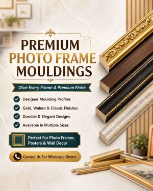 A collection of premium photo frame mouldings in gold, walnut, black, and silver finishes displayed on a marble background.