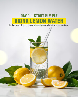 Glass of lemon water with lemons and leaves, promoting healthy digestion.