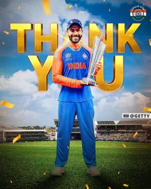 Virat Kohli holding a trophy in an Indian cricket jersey