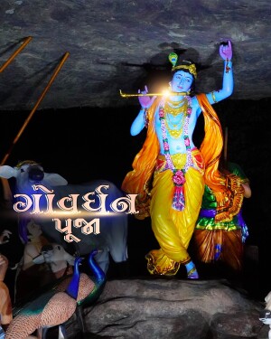 Statue of Lord Krishna playing the flute during Govardhan Puja