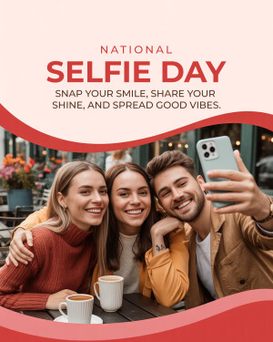 Three friends taking a selfie at a cafe for National Selfie Day