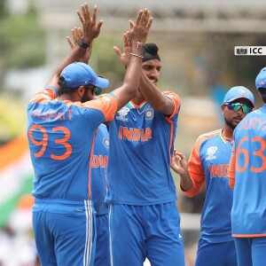 Indian cricket team players celebrating a wicket during a match