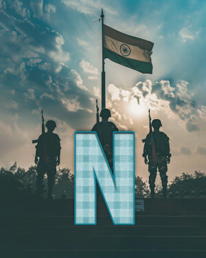 Silhouette of soldiers with the Indian flag waving in the background