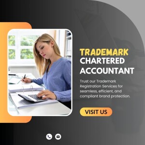 Woman working with calculator and documents, promoting trademark and chartered accountant services.
