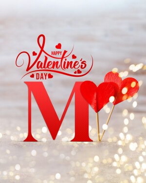 Red letter M with heart decorations for Valentine's Day