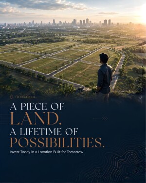 A man overlooking a large plot of land for sale with a city skyline in the background during sunset