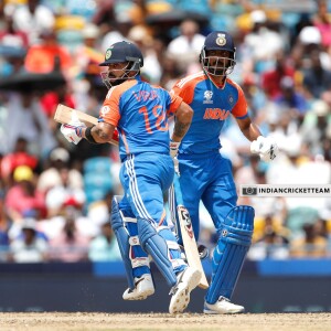 Virat Kohli and Rohit Sharma running for a single during a cricket match