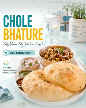 Freshly prepared Chole Bhature with sides on a white plate
