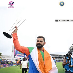 Virat Kohli celebrating with the World Cup trophy wrapped in the Indian flag