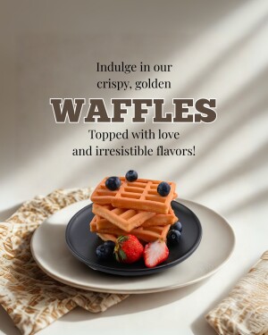 Stack of golden waffles topped with blueberries and strawberries on a plate
