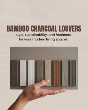 Hand holding samples of bamboo charcoal louvers in various shades.