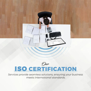 Woman working at a desk with documents and a calculator, with ISO Certification graphic