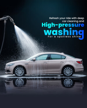A silver car being washed with a high-pressure water spray.