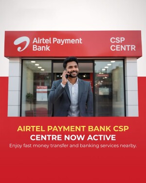 A man standing in front of an Airtel Payments Bank CSP Center, talking on his phone.